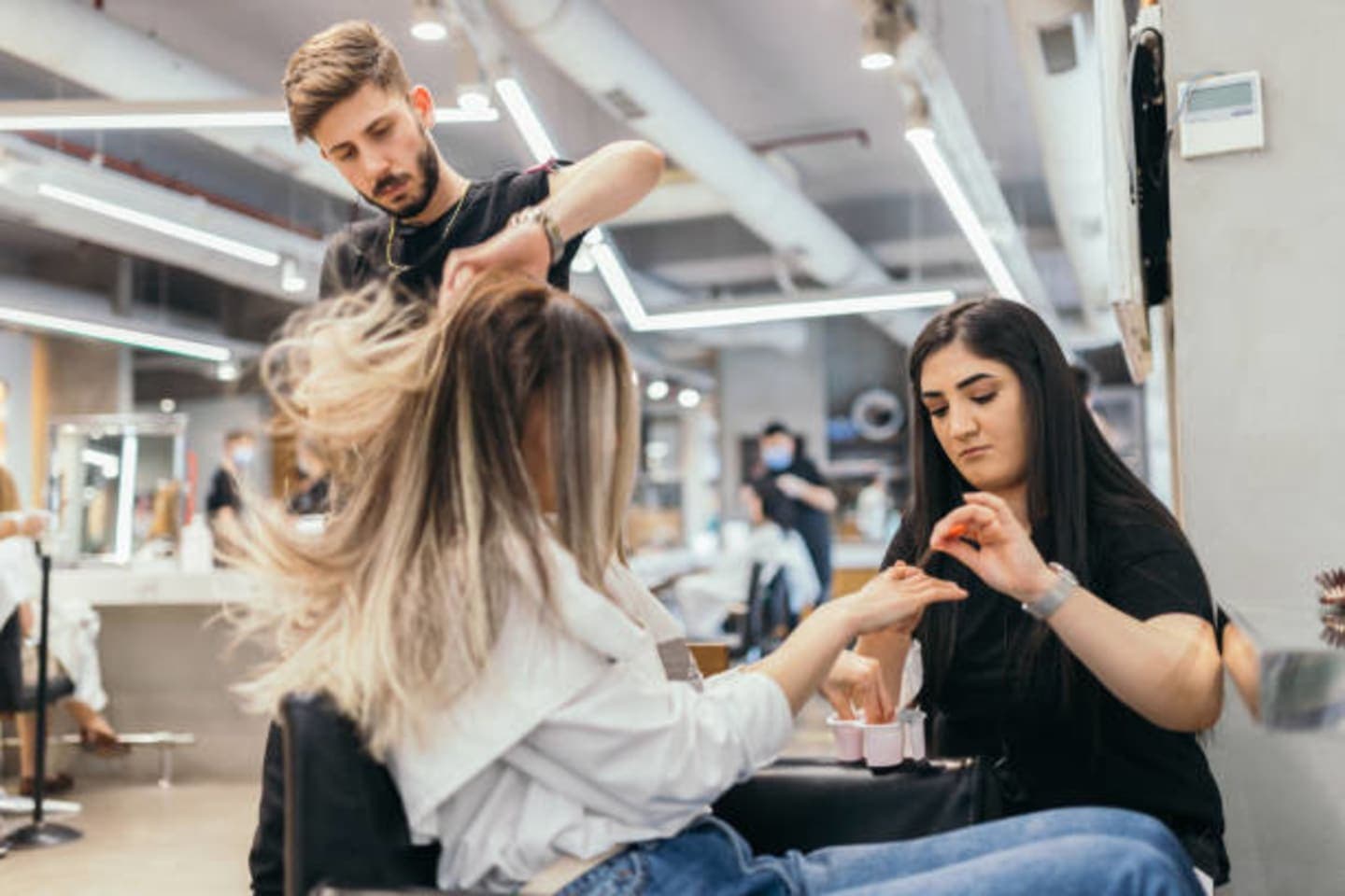Woman searching for a beauty salon near me in UAE using Extraa AE app